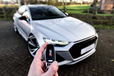 Issues and Solutions for Ignition Repair and Push Start Systems in Port Charlotte FL - Smart Key in Hand with Modern Car